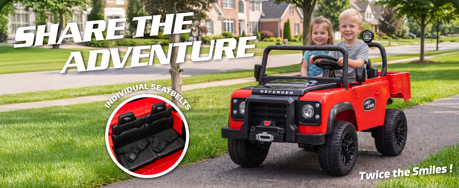 Two children riding the Land Rover Defender two-seater ride-on car with individual seat belts
