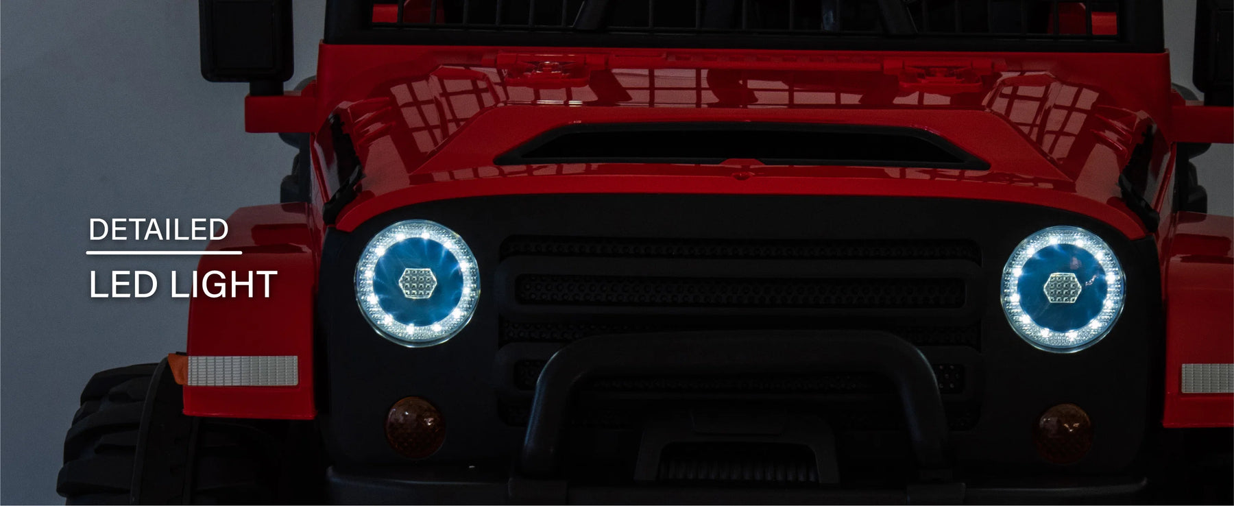 Illuminated LED headlights on the red 24V kids ride-on Jeep
